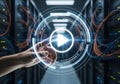 Hand activating a virtual play button in a data center Royalty Free Stock Photo