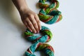 Person adding a rainbow bagel Royalty Free Stock Photo