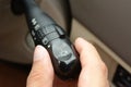 Hand adjusting car headlight control switch Royalty Free Stock Photo