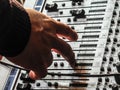 hand adjusting sound mixer settings