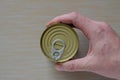 Hand of an adult man holds a can of canned food Royalty Free Stock Photo