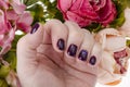 Hand of an adult woman with painted nails, manicure, nail polish Royalty Free Stock Photo