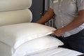 Hand of african woman maid making bed in hotel Royalty Free Stock Photo