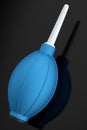 Hand air blower bulb for camera isolated on black background.