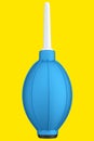 Hand air blower bulb for camera isolated on yellow background. Royalty Free Stock Photo