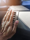 Hand on air conditioner vents car Royalty Free Stock Photo