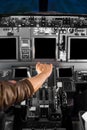 Hand on Airplane Cockpit thrust levers Royalty Free Stock Photo