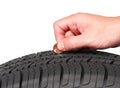 Hand with american cent coin check tire condition isolated