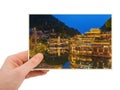 Hand and Ancient town Fenghuang at sunset in Hunan China my photo