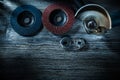 Hand angle grinder radial polishing discs on vintage wooden boar