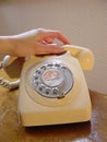 Hand on antique telephone