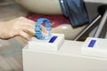 Hand applies the bracelet to the turnstile for passage through the ticket system.