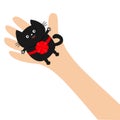 Hand arm holding black cat with red round bow ribbon. Adopt animal pet. Helping hands concept. Funny gift. Cute cartoon character. Royalty Free Stock Photo