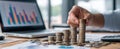 The hand arranging coins in a stack on a financial workspace. AI generated image Royalty Free Stock Photo