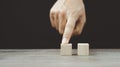 Hand arranging wood block stacking as step stair on wooden table. Business concept for growth success process. Copy space Royalty Free Stock Photo