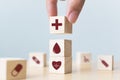 Hand arranging wood block stacking with icon healthcare medical Royalty Free Stock Photo
