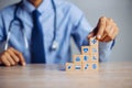 Hand arranging wood block stacking with icon healthcare medical, Insurance for your health medical, Insurance for your health