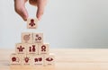 Hand arranging wood block stacking with icon leader business. Key success factors for leadership elements concept Royalty Free Stock Photo