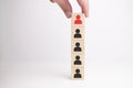 Hand arranging wooden blocks stacking as a column on white background Royalty Free Stock Photo