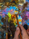 Hand of artist with a paintbrush Royalty Free Stock Photo