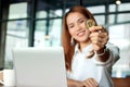 Hand of Asian business woman showing cryptocurrency golden bitcoin coin in office. Virtual money on digital. Royalty Free Stock Photo