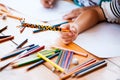 Hand of asian child girl holding crayon for drawing and painting Royalty Free Stock Photo