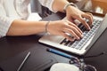 Hand of asian men using laptop keyboard with English and Thai alphabets on black table at home office .selective focus Royalty Free Stock Photo