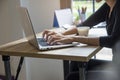 Hand of Asian Student typing report and research in library.Business woman working on laptop.Beautiful young freelancer writing Royalty Free Stock Photo