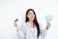 The hand of an Asian woman holding a credit card is used for online shopping and Internet payments