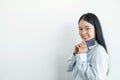 The hand of an Asian woman holding a credit card is used for online shopping and Internet payments