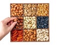 Hand with assorted nuts and dried fruit collection. Different superfoods. Vegetarian snack of different nuts. organic mixed nuts Royalty Free Stock Photo