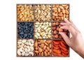 Hand with assorted nuts and dried fruit collection. Different superfoods. Vegetarian snack of different nuts. organic mixed nuts Royalty Free Stock Photo