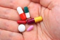 Hand with assorted pills Royalty Free Stock Photo