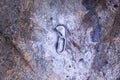 Hand attaching carabiner on rock