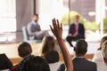Hand in audience raised for a question at a business seminar Royalty Free Stock Photo