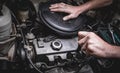 Hand of auto mechanic with a wrench.