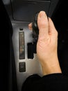 Hand on an automatic transmission gear shifting stick Royalty Free Stock Photo