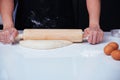 Hand of woman making dough with rolling wooden Royalty Free Stock Photo