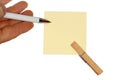 Hand with ballpen and yellow paper Royalty Free Stock Photo