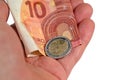 Hand with banknote and coin symbolic of minimum wage Royalty Free Stock Photo