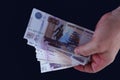 In the hand of the banknotes. 550 ruble russian. Front view