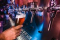 Hand of bartender pouring a large lager beer in tap Royalty Free Stock Photo
