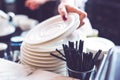 Hand of bartender with saucers and plastic straws Royalty Free Stock Photo