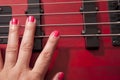 Hand on bass guitar Royalty Free Stock Photo