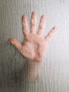 hand behind frosted glass window Royalty Free Stock Photo