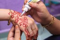 Hand being decorated with henna Royalty Free Stock Photo