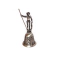 Hand bell made of metal with a figurine Don Quixote isolated on