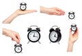 Hand with black alarm clock, vintage style watches, set and collection Royalty Free Stock Photo