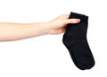 Hand with black cotton sock, foot clothing