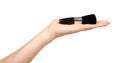 Hand with black eye makeup brush. Isolated Royalty Free Stock Photo